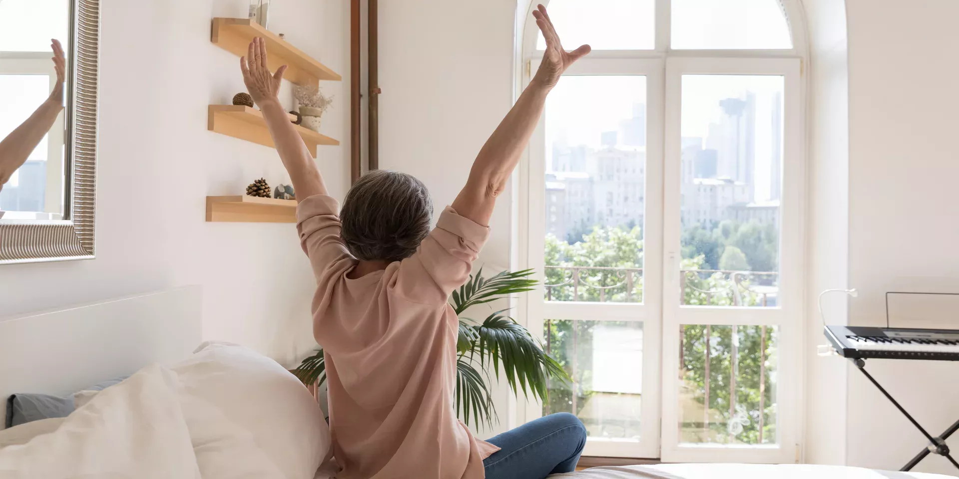 mature woman looking out of the window