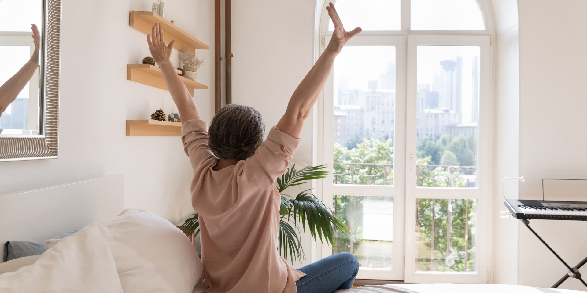 mature woman looking out of the window