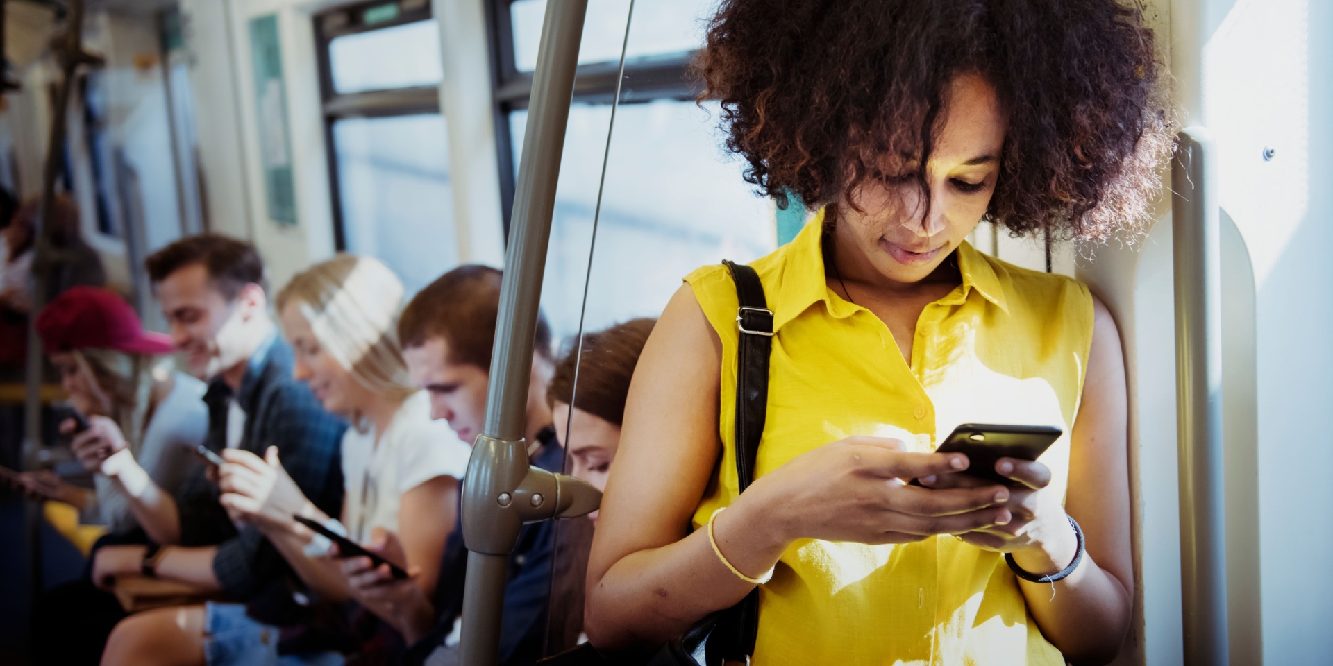 A woman on the train using her phone