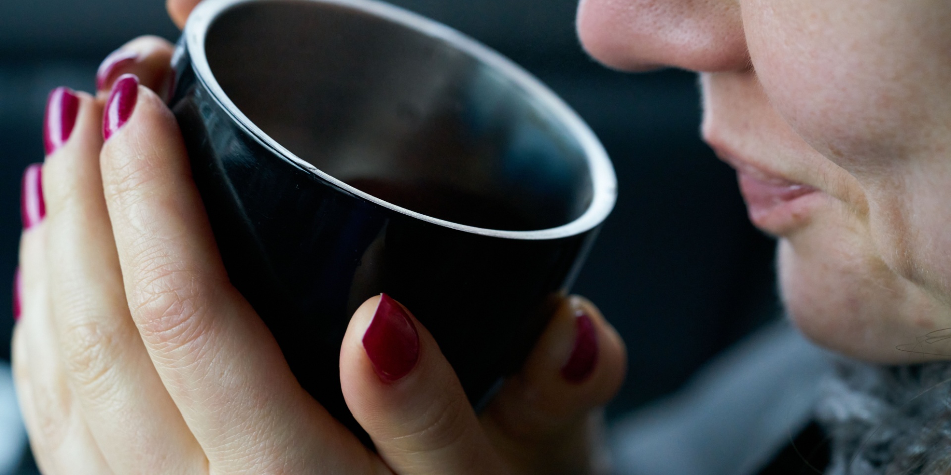 woman drinking a cup of tea