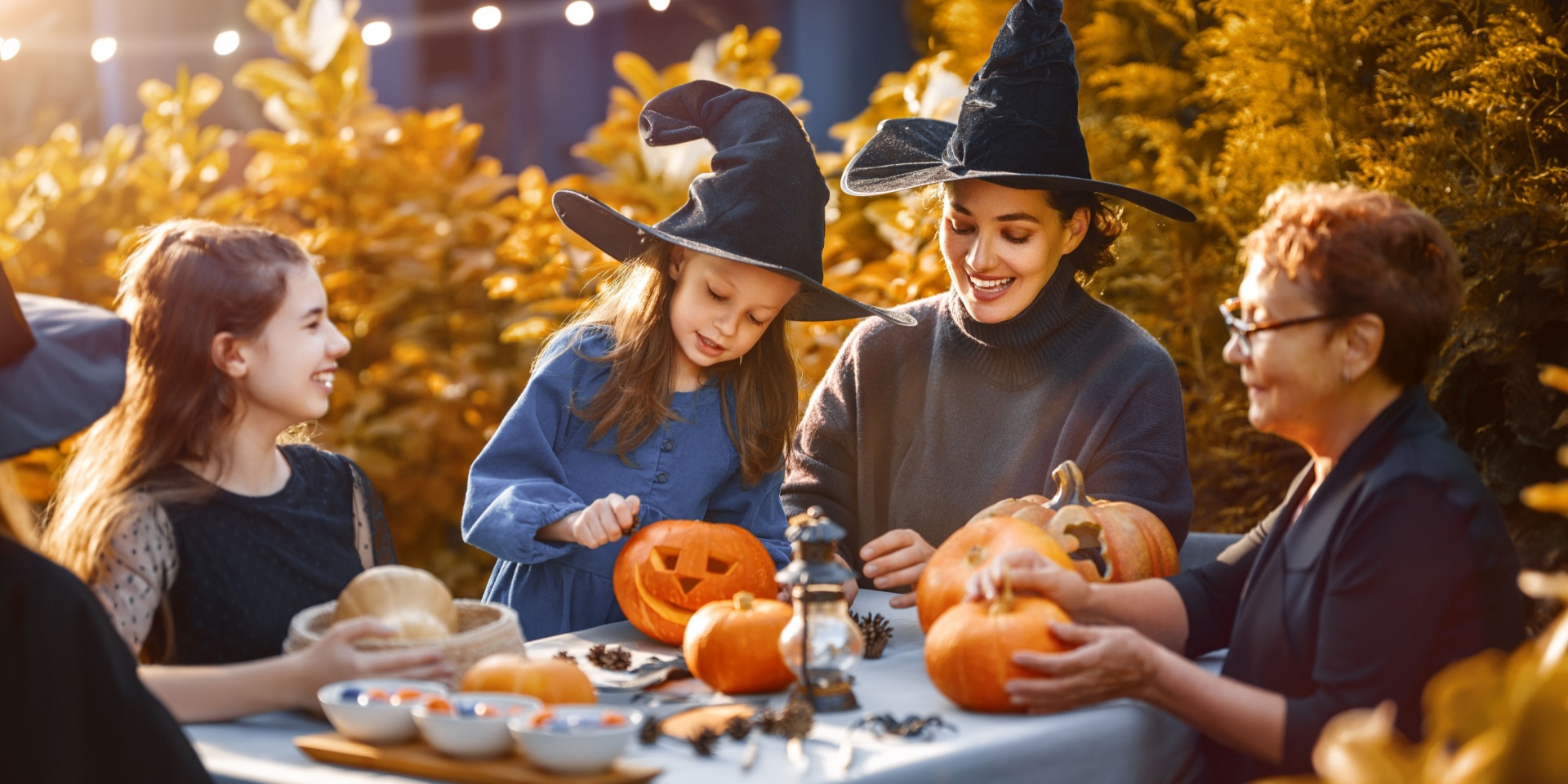 A family carving pumpkins for Halloween.